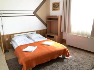 Posteľ alebo postele v izbe v ubytovaní ART Éden