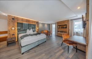 Rúm í herbergi á Hotel Comploj Adults only