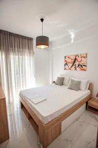 a bedroom with a large bed in a room at MG apartments in Alexandroupoli