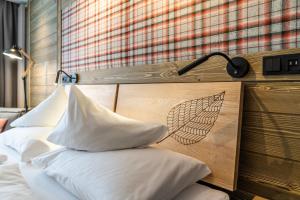 Postel nebo postele na pokoji v ubytování Hotel OTP Birkenhof
