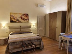 Postel nebo postele na pokoji v ubytování RF Duomo suites