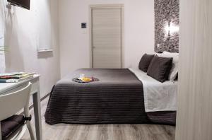 Postel nebo postele na pokoji v ubytování Venere Rooms