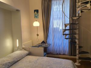 Postel nebo postele na pokoji v ubytování RF Duomo suites