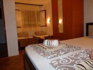 a bedroom with two beds with towels on them at Apartments Aleksic in Sutomore