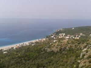 an aerial view of a beach and the ocean at SeaSide Villas in Dhërmi