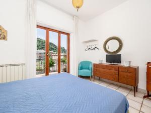 Postel nebo postele na pokoji v ubytování Marea Suite - De Vivo Realty Sorrento
