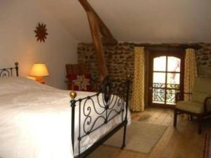 Un pat sau paturi într-o cameră la Maison Balenti