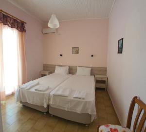 Postel nebo postele na pokoji v ubytování Errika