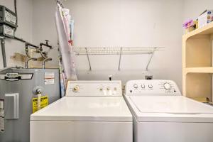a laundry room with a washer and dryer at Docks and Balcony Peaceful River Abode in Dunnellon in Dunnellon +21 photos