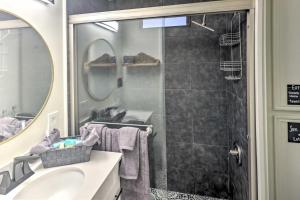 a bathroom with a shower and a sink and a mirror at Dock and Beach Access Cozy Lake Havasu City Home! in Lake Havasu City +22 photos