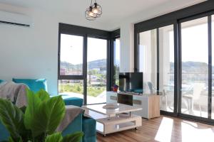 a living room with a couch and a table at MaNora in Ulcinj