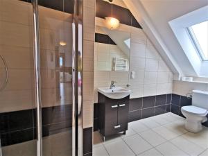 a bathroom with a sink and a toilet at Przedsiębiorstwo Turystyczne "SOL" in Grzybowo +136 photos