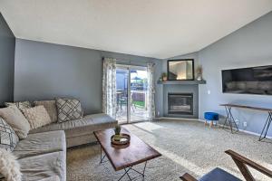 a living room with a couch and a fireplace at Bright Omaha Family Home with Grill and Deck! in Omaha