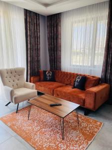 a living room with a couch and a coffee table at Apart Angel Suit 3 in Nevsehir