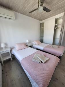 A bed or beds in a room at Torredembarra cosy, well equipped house, 5 min. from the beach