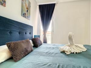 Łóżko lub łóżka w pokoju w obiekcie Ribera Beach 1 - 2906