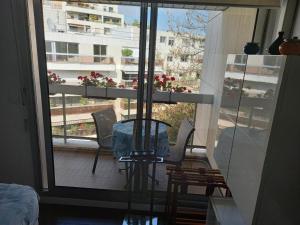 a room with a window with a view of a building at Parisian Sparkle Retreat in Neuilly-sur-Seine