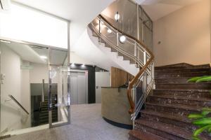 a staircase in a building with a glass wall at Torreluz Centro in Almería