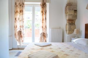 Postel nebo postele na pokoji v ubytování B&B Al Vecchio Olmo