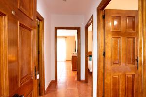 a hallway with a door and a bathroom at CUENCALOFT APARTAMENTOS RURALES FUENTES in Fuentes +42 photos