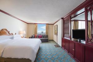 a hotel room with a bed and a television at Fiesta Americana Reforma in Mexico City