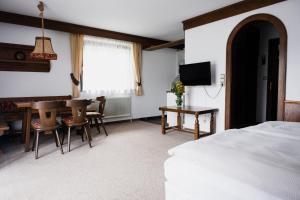 Televízia a/alebo spoločenská miestnosť v ubytovaní Pension Baranek - Baranek Resorts