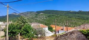 a village with a mountain in the background at Stella House in Theológos