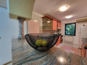 a kitchen with a bowl on top of a counter at EDEN Residence in Skopje