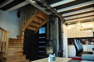 a kitchen with a wood stove in a room at Domki u Biesiady in Lesko