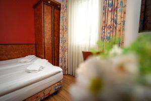 Postel nebo postele na pokoji v ubytování Hotel Miramar am Römer