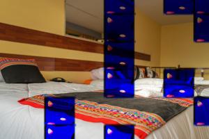 Letto o letti in una camera di Rituales Inn Cusco - San Blas