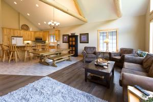 a living room with a couch and a table at Interlachen Unit 3 in Nisswa