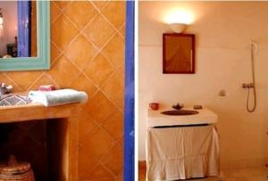 a bathroom with a sink and a shower with a mirror at Riad Dar Latifa in Essaouira