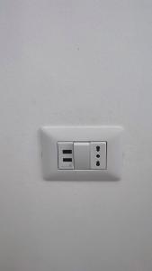 a white outlet on a white wall at Leo Holiday Homes in Deiva Marina