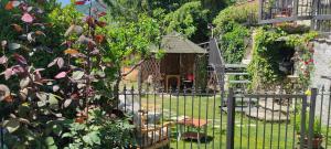 a fence with a small bird house in a yard at Villa Ola in Barrea
