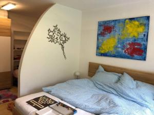 A bed or beds in a room at Family Appartment - Dachstein View