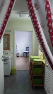 a room with a kitchen with a table and a chair at Family Appartment - Dachstein View in Ramsau am Dachstein