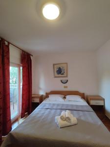 Postel nebo postele na pokoji v ubytování Apartments Markota