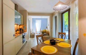 a kitchen and dining room with a table and a dining room at BALTIC SUNSHINE in Świnoujście