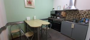 A kitchen or kitchenette at Aheloy Apartments