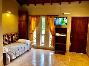 A bed or beds in a room at Aires Del Delta