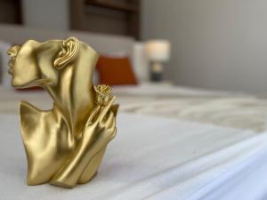 a gold dog figurine sitting on a table at Villa Sea View in Fouka Bay North Coast with pool in Marsa Matruh