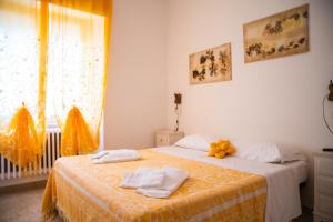 Postel nebo postele na pokoji v ubytování B&B Al Vecchio Olmo