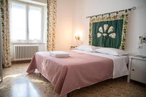 Postel nebo postele na pokoji v ubytování B&B Al Vecchio Olmo