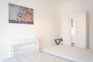 A bed or beds in a room at Appartamento Corsaro