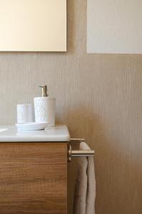 a bathroom with a sink and a towel at La Minditta in San Teodoro