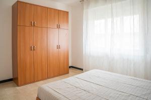 A bed or beds in a room at Appartamento Corsaro