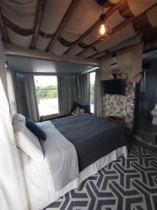 Cama ou camas em um quarto em Galinha d'Angola