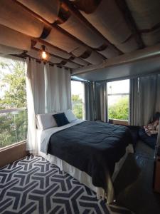 Cama ou camas em um quarto em Galinha d'Angola