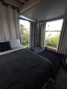 Cama ou camas em um quarto em Galinha d'Angola